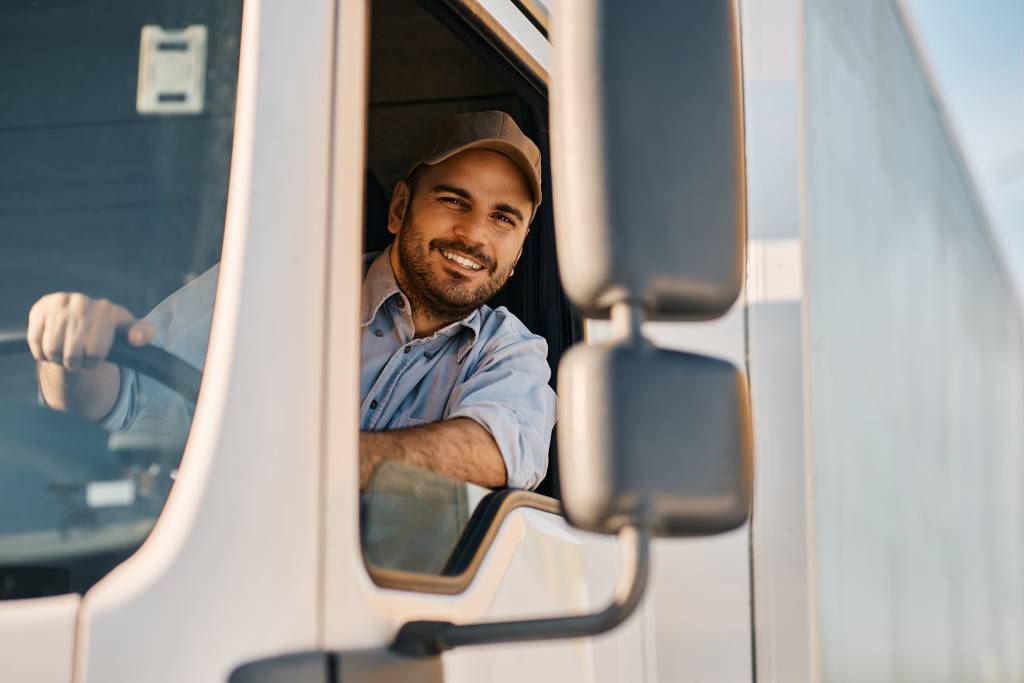 Professional truck driver in the cab of his truck